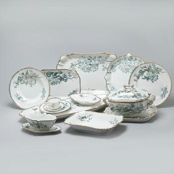 A earthenware table set of 136 pcs "Vexiö Guld",  by Arvid Ekberg, Gustafsberg, from around year 1900.
