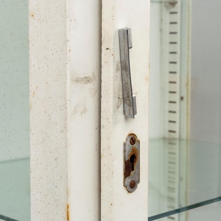 A metal doctor's cabinet, mid 20th century.