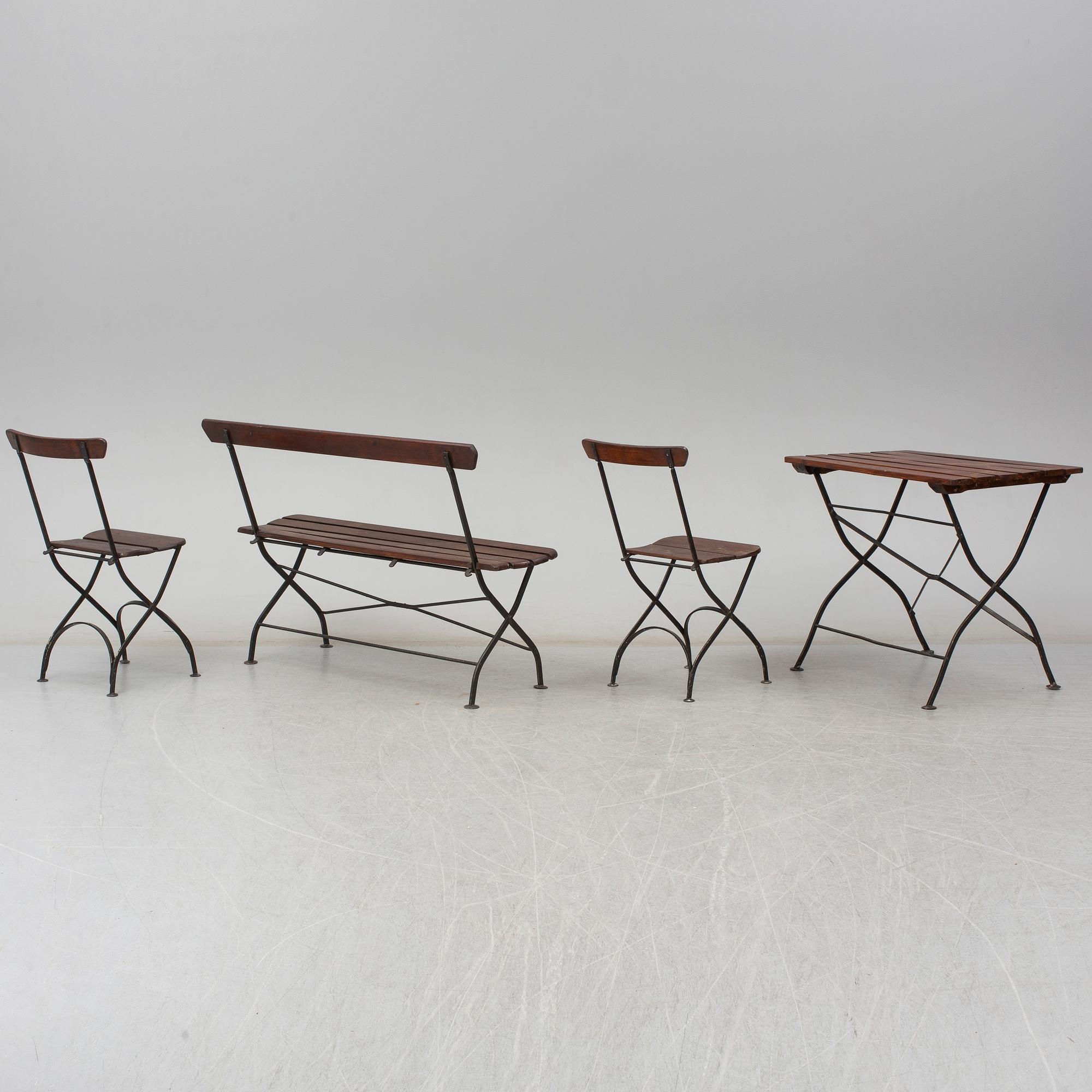 A garden sofa, table and a pair of chairs, first half of the 20th century.