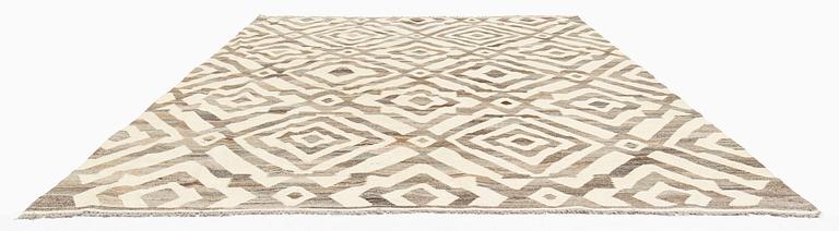 A Kilim carpet, c. 290 x 250 cm.