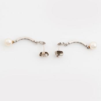Necklace and earrings, a pair, cultured pearls, white gold, and brilliant- and octagon-cut diamonds.