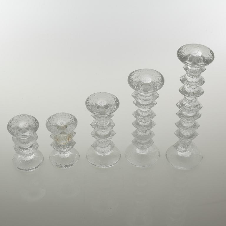 Five glass candlesticks by Timo Sarpaneva for Iittala, model "Festivo", second half of the 20th century.