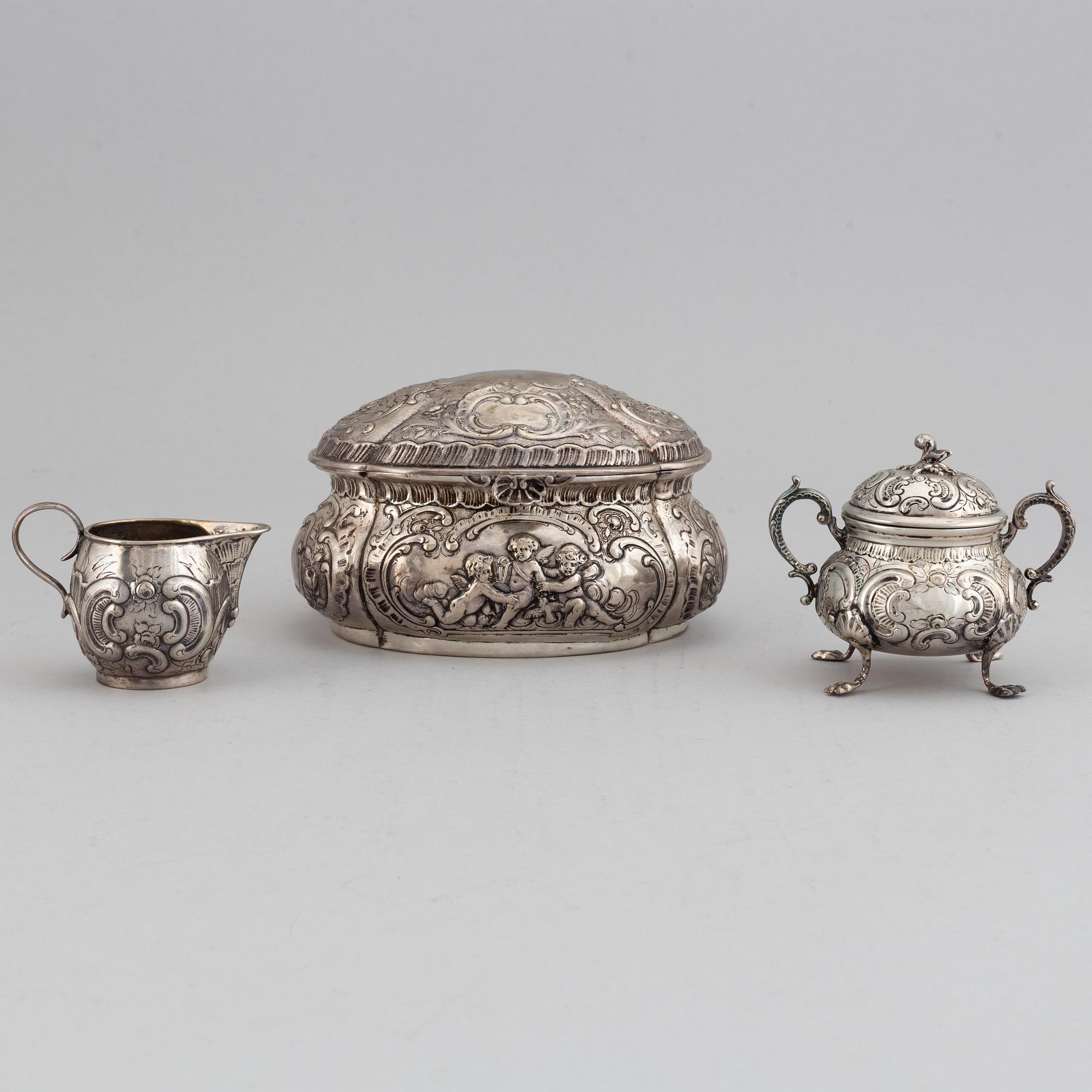A german silver 800 sugar box, creamer and sugar bowl.
