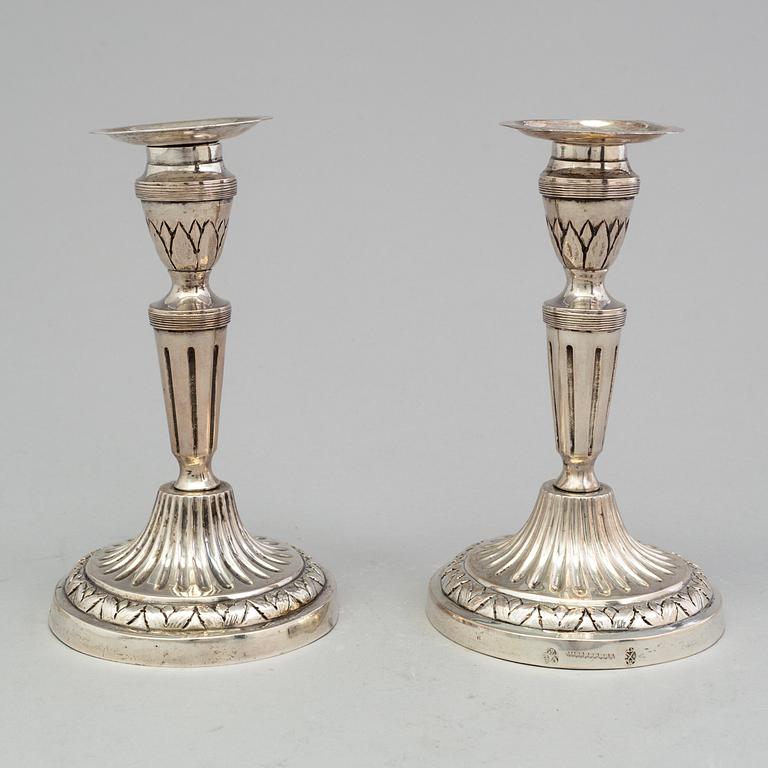 A pair of late 18th century silver candlesticks with unclear hallmarks, possibly from Germany. Weight ca 316 grams.