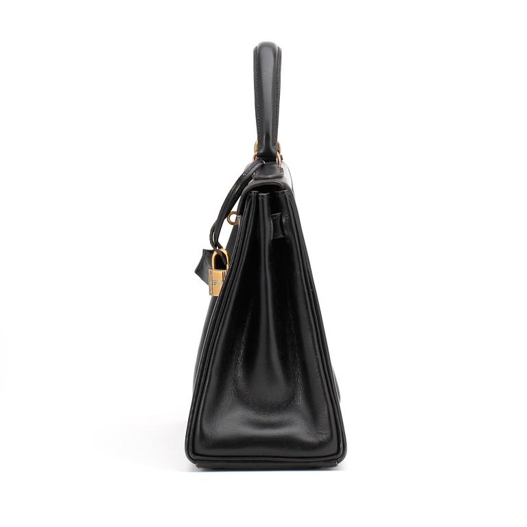 HERMÈS, a black leather bag, "Kelly 28".