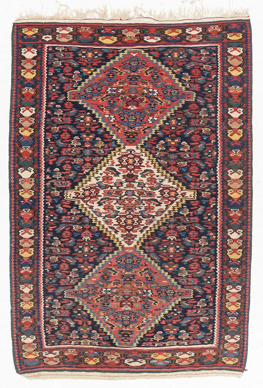 An oriental rug, circa 167 x 114 cm.
