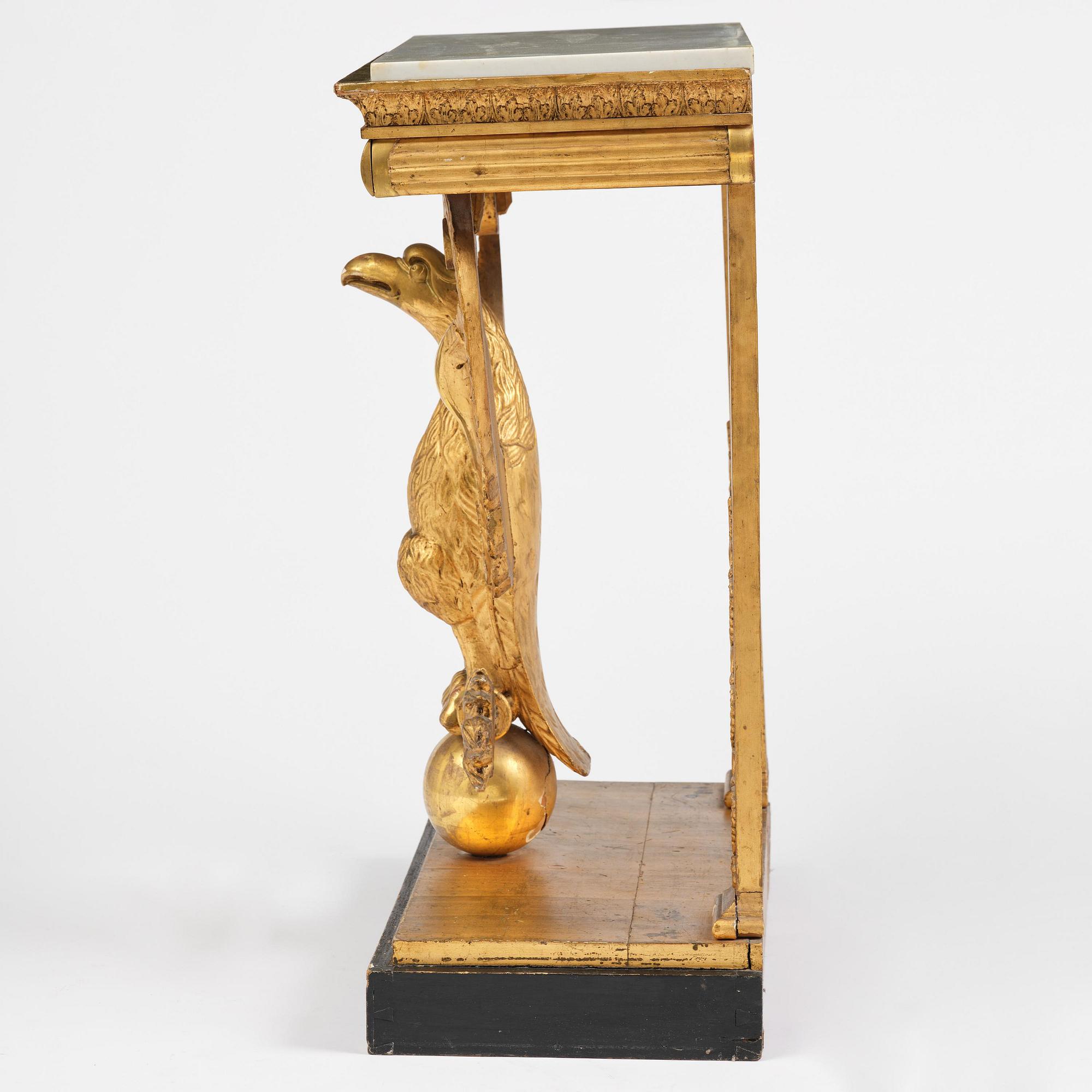 A Swedish Empire giltwood console table, early 19th century.