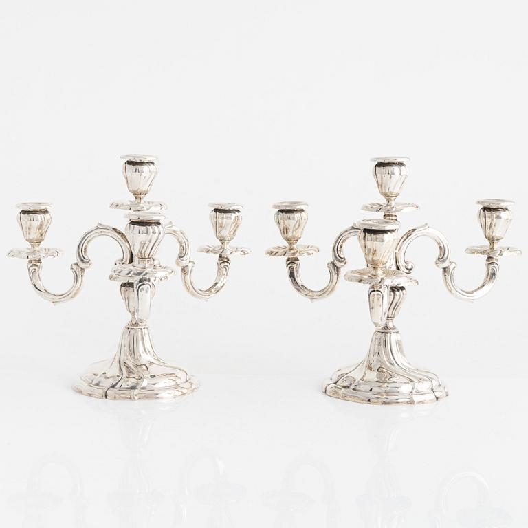 A pair of silver Rococo-style candelabra, Germany, first half of the 20th century.