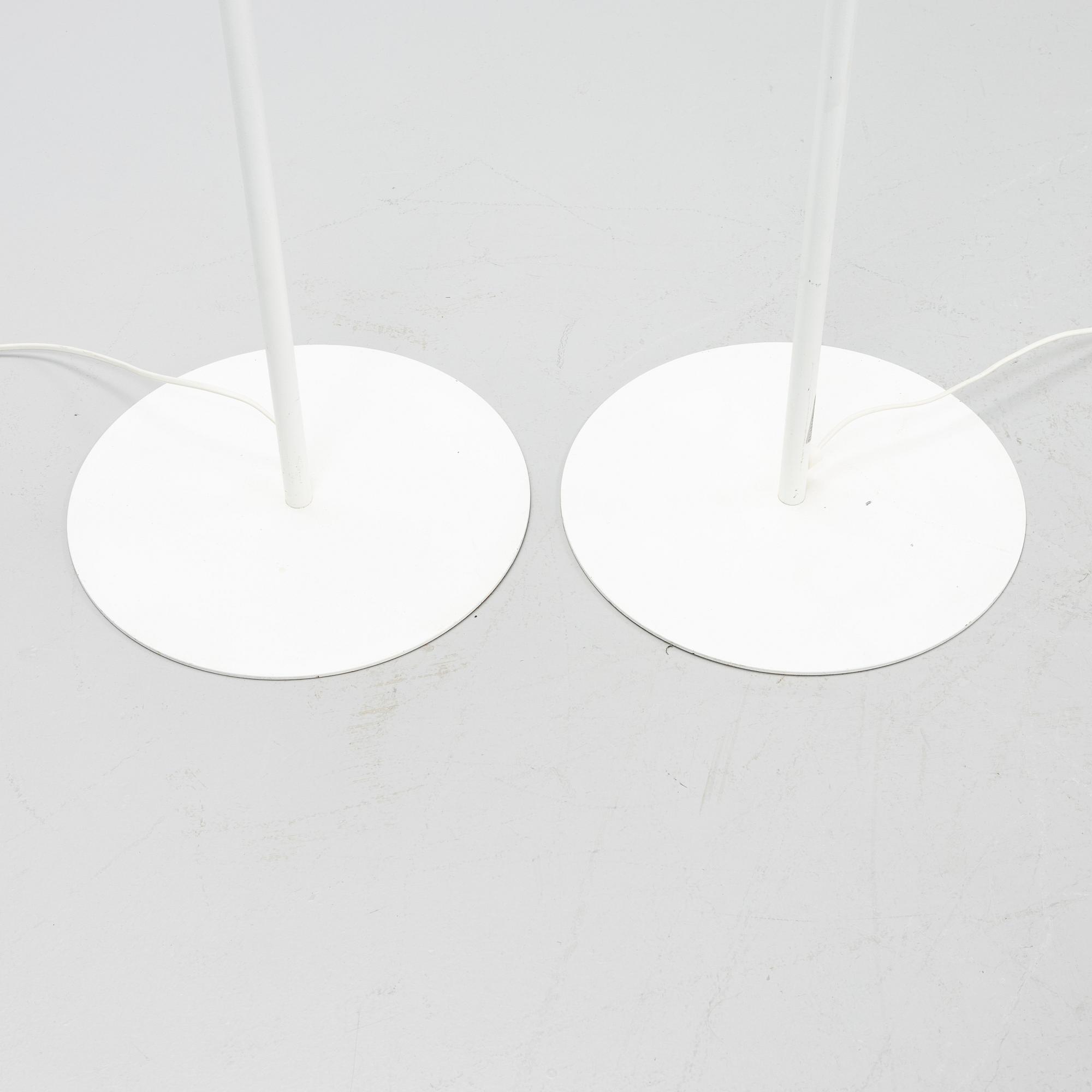 A pair of whithe floor lights, Luxus, Vittsjö.