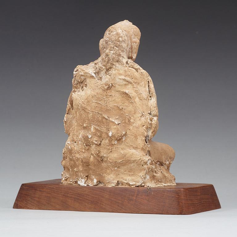 A stucco figure of a seated buddha, Gandhara, 2nd/3rd Century.
