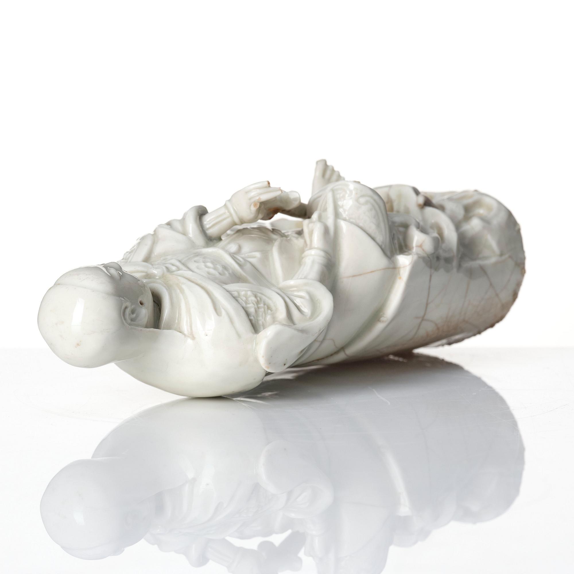 A Chinese blanc de chine/dehua figure of a Zhenwu, late Ming dynasty (17th century).