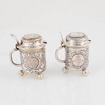 Candlesticks, a pair, Gustaf Möllenborg, Stockholm 1844, and two salt cellars including CG Hallberg, Stockholm 1897.