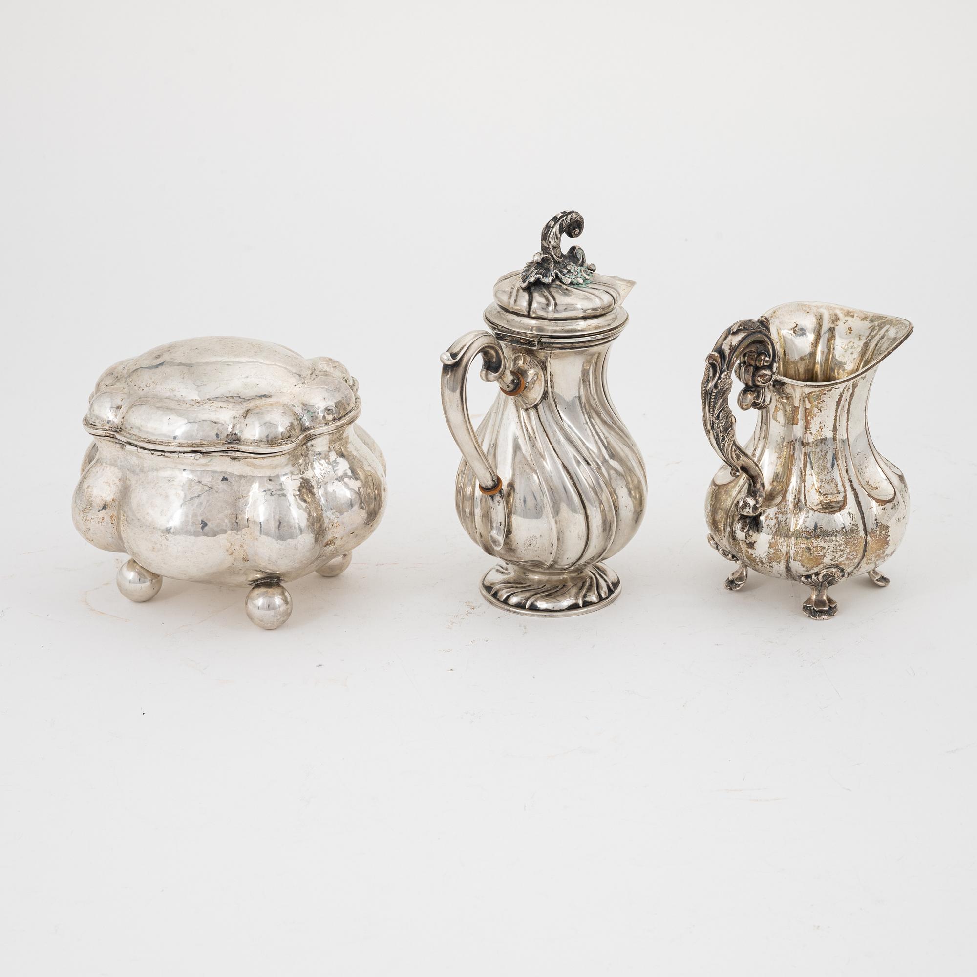 A Rococo style silver sugarbox and two creamers, including Lars Larsson ...