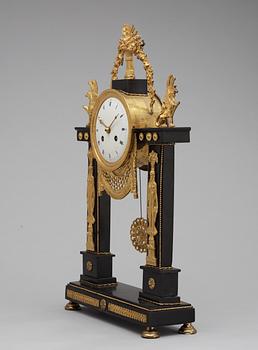 A French Louis XVI late 18th century gilt bronze and marble mantel clock.