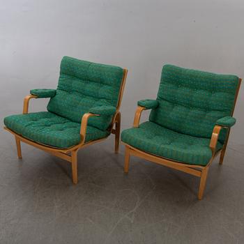 BRUNO MATHSSON, a pair  of easy chairs "Ingrid" for DUX.