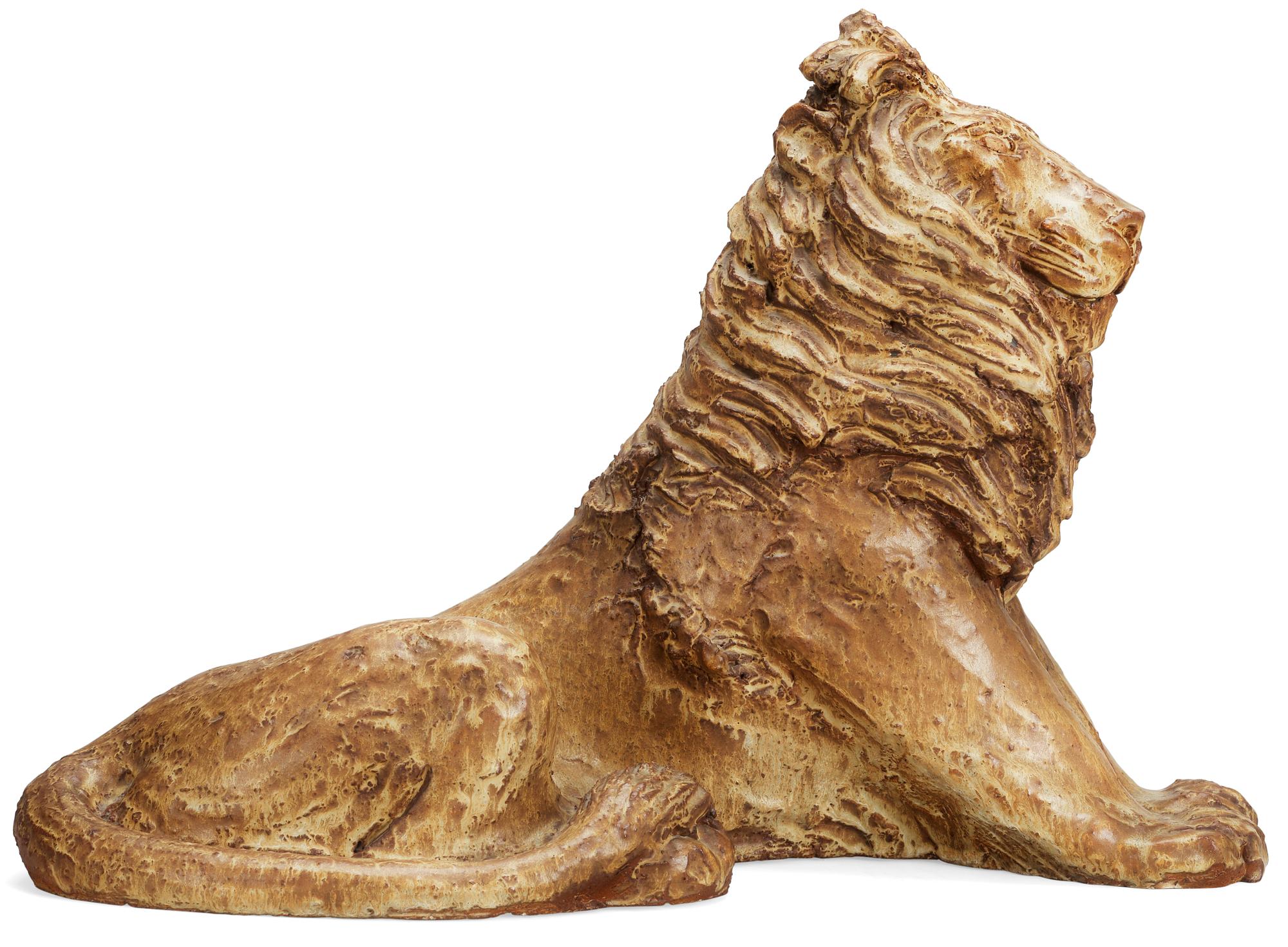 A Michael Schilkin stoneware sculpture of a lion, Arabia, Finland, 1940's.