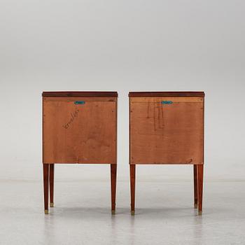 A pair of mahgany veneered bedside cabinets, early 20th Century.