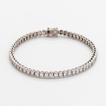 Tennisrannekoru, 18K valkokultaa, briljanttihiottuja timantteja.