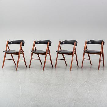 Four 1960s teak chairs.