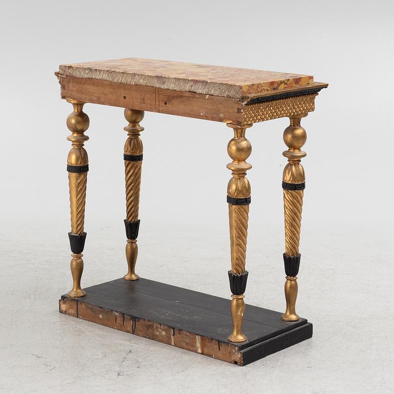 A late Gustavian giltwood, patinated and marble console attributed to J. Frisk (master in Stockholm 1805-24).