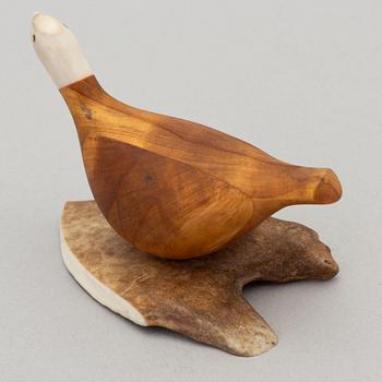 Lars Levi Sunna, a reindeer horn and birch figurine of a grouse, signed.