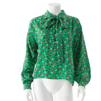 YVES SAINT LAURENT, a green silk blouse.