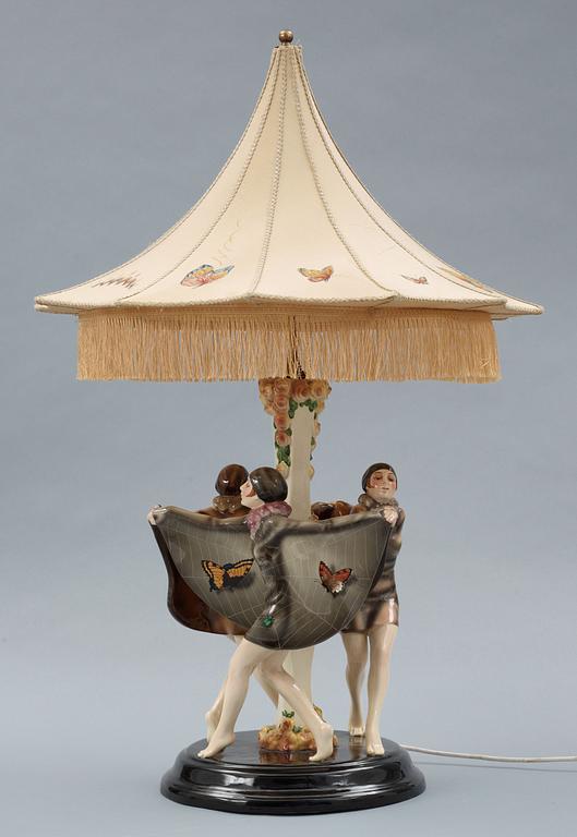 A Josef Lorenzl "The captured bird" triple figural lamp, Goldscheider, Wien circa 1925.