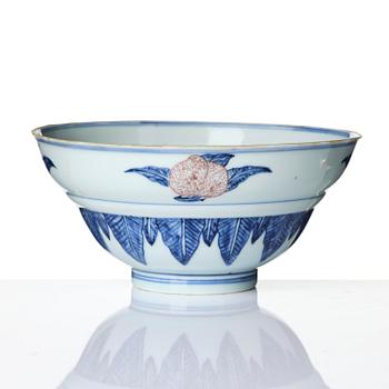A blue and white and copper-red 'peaches' bowl, Qing dynasty.
