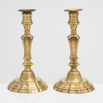 A pair of 18th century brass, argent haché candlesticks, Régence, France.