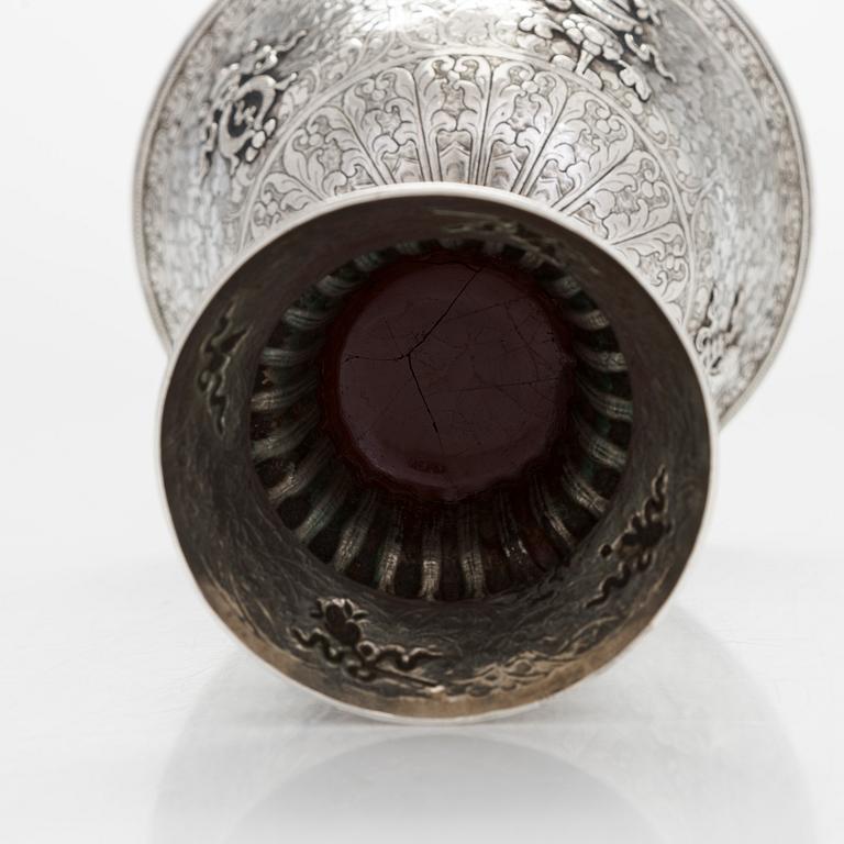 A Tibetan butter lamp, silver, early 19th century.