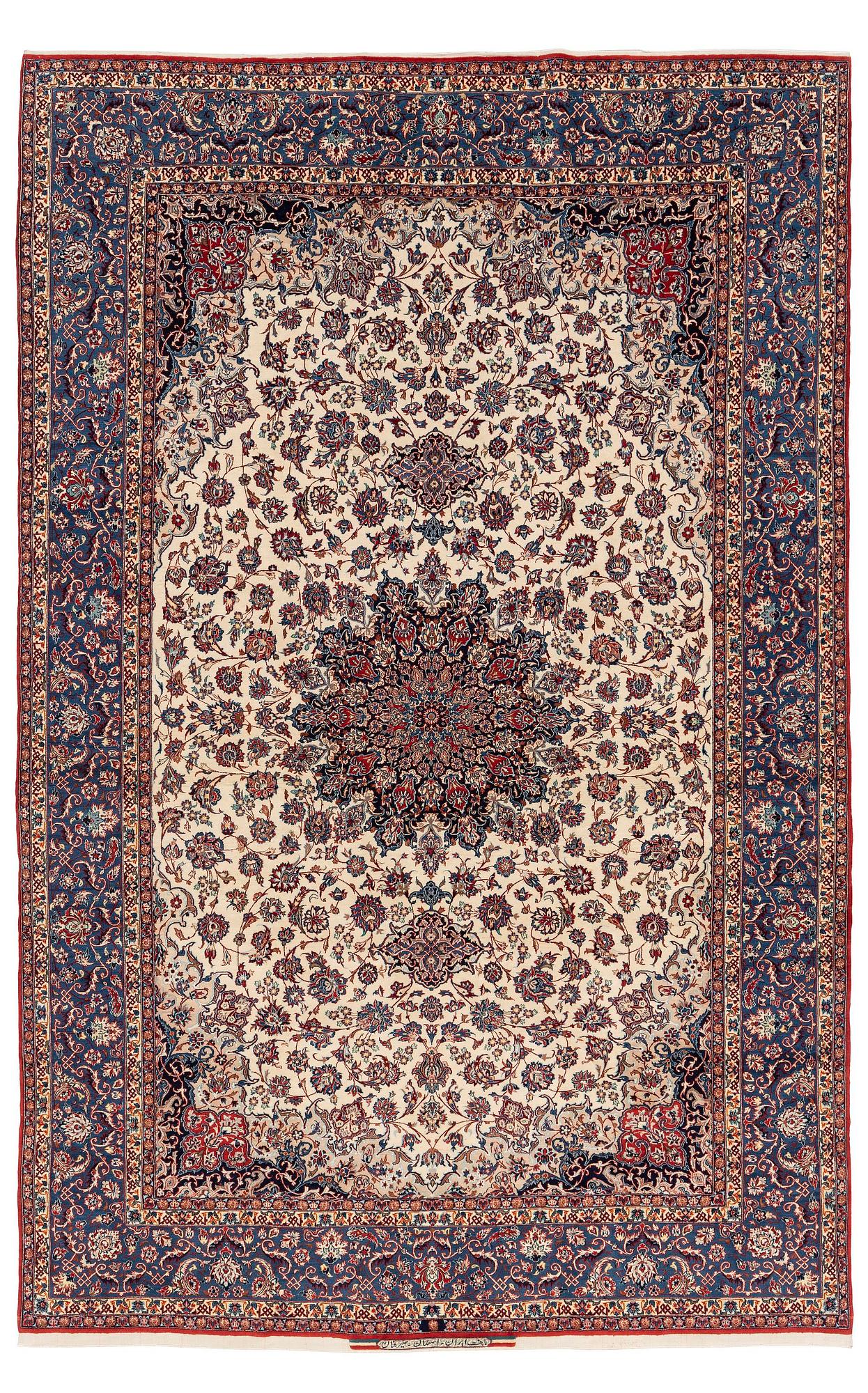 A semi-antique Isfahan carpet, Central Persia, signed (Ali) Seirafian, 328 x 250 cm.
