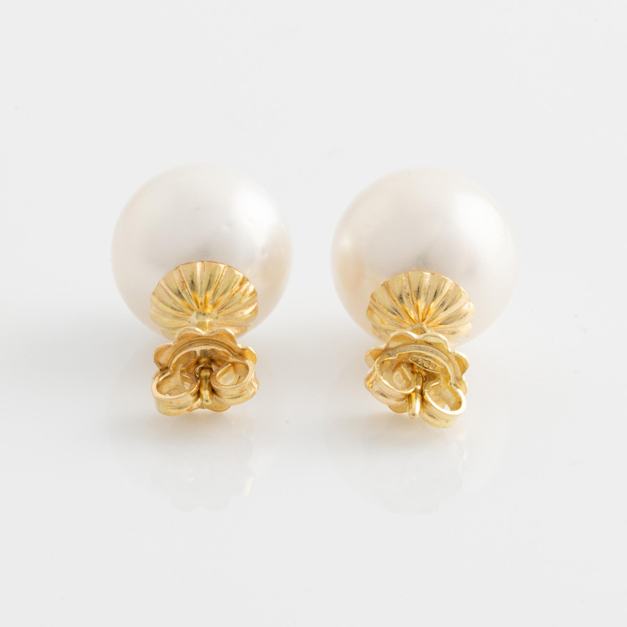 Earrings with cultured South Sea pearls.