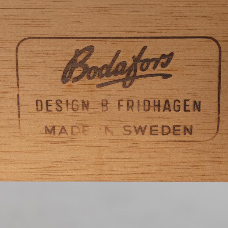 Bertil Fridhagen, a 'Diamant' walnut veneered dining table, with four additional leaves.  Bodafors.