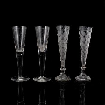 A mixed lot of nineteen 19th century Empire wine- and champagne glasses.