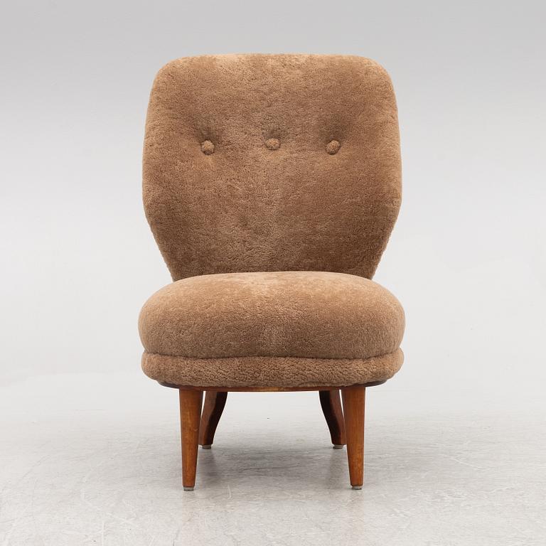 A mid 20th century easy chair,.