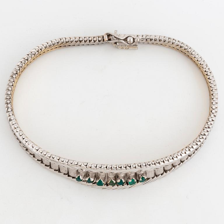 Bracelet with emeralds.