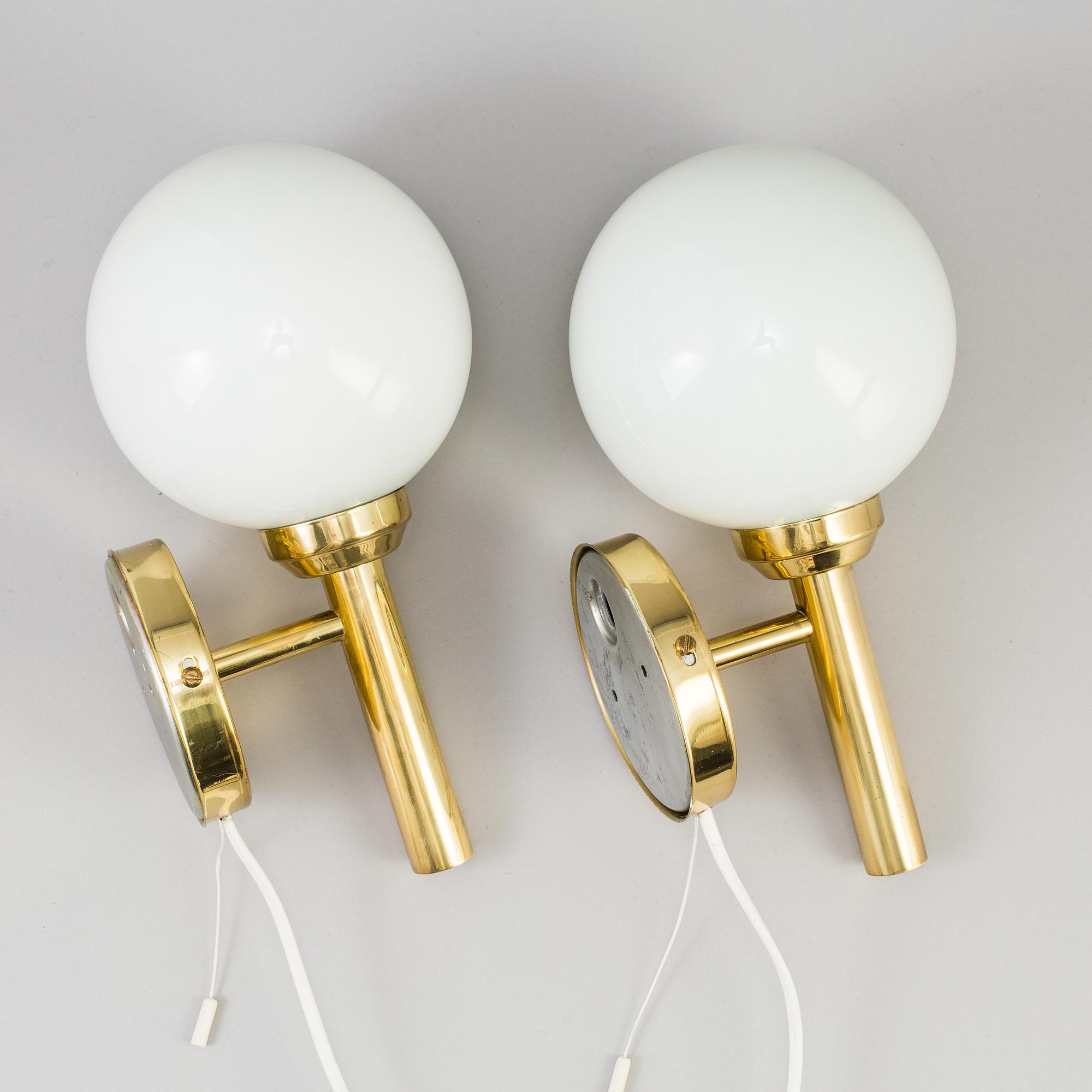 A pair of 20th century brass wall lights by Abo Denmark.
