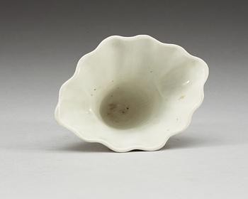 A blanc de chine libation cup in the shape of a rhinoseroushorn, Qing dynasty, Kangxi (1662-1722).