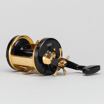 A guilded Ambassadeur 10000C De Luxe REEL BY ABU, SWEDEN. 1990.