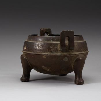 A bronze tripod censer, presumably Han dynasty (206 B.C-220 A.D).