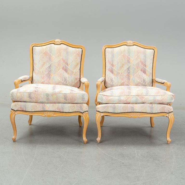 An end of the 20th Century pair of rococo style armchairs.