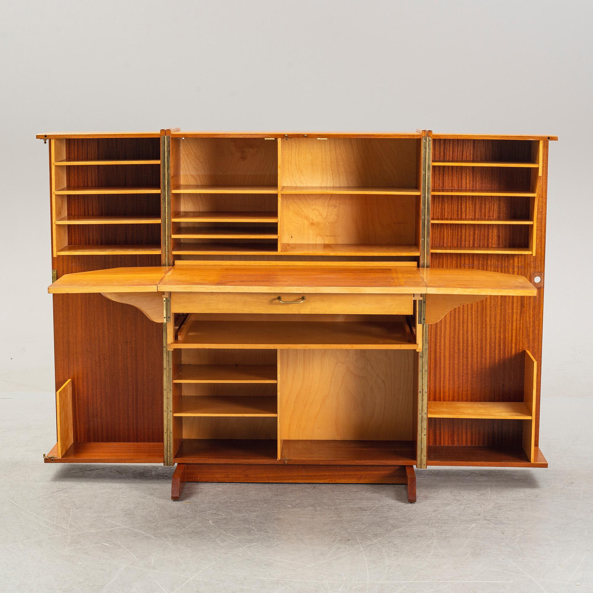 A mahogany veneered convertible cabinet, mid 20th Century.