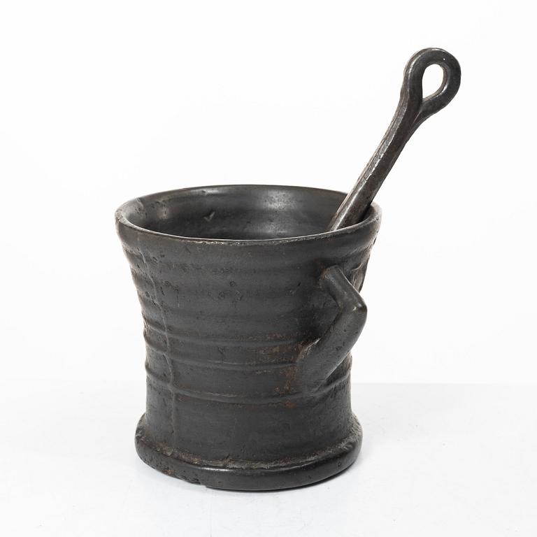 Mortar and pestle, dated 1673.