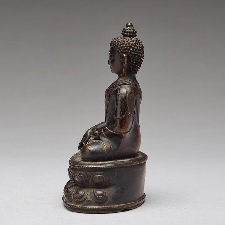 A copper alloy figure of Buddha Shakyamundi, Tibet, 17th Century.