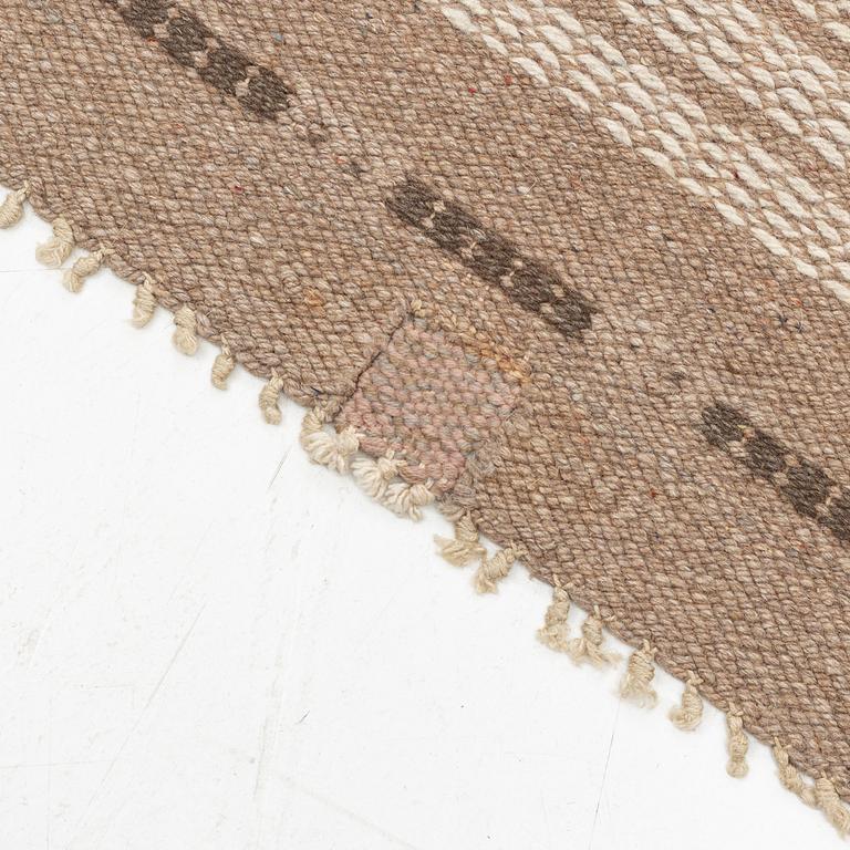 A  Swedish Flat weave carpet in relief, approximately 305 x 200 cm.