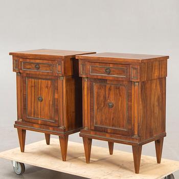 A pair of walnut Empire style bedside tables first half of the 20th century.