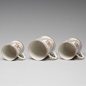 A group of three famille rose armorial jugs, Qing dynasty, Qianlong (1736-95).