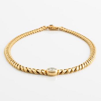 Collier, 18K guld med  briljantslipad diamant.