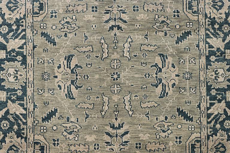 An oriental carpet with Mamluk design, c. 372 x 277 cm.