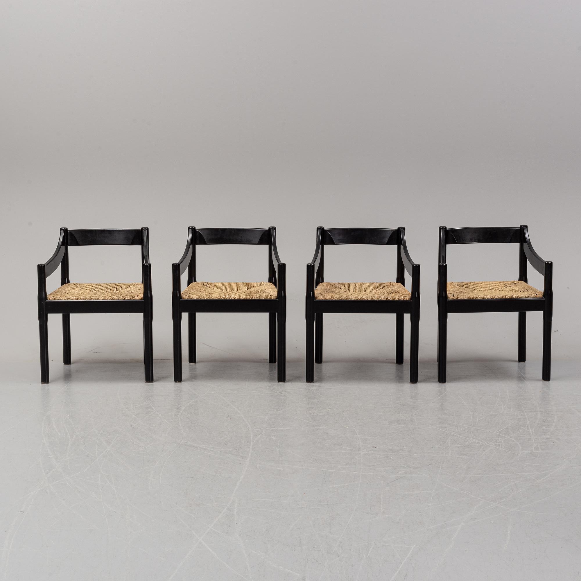 Vico Magestretti. Four black lacquered chairs with rope seats, "Carimate". Cassina, Italy.